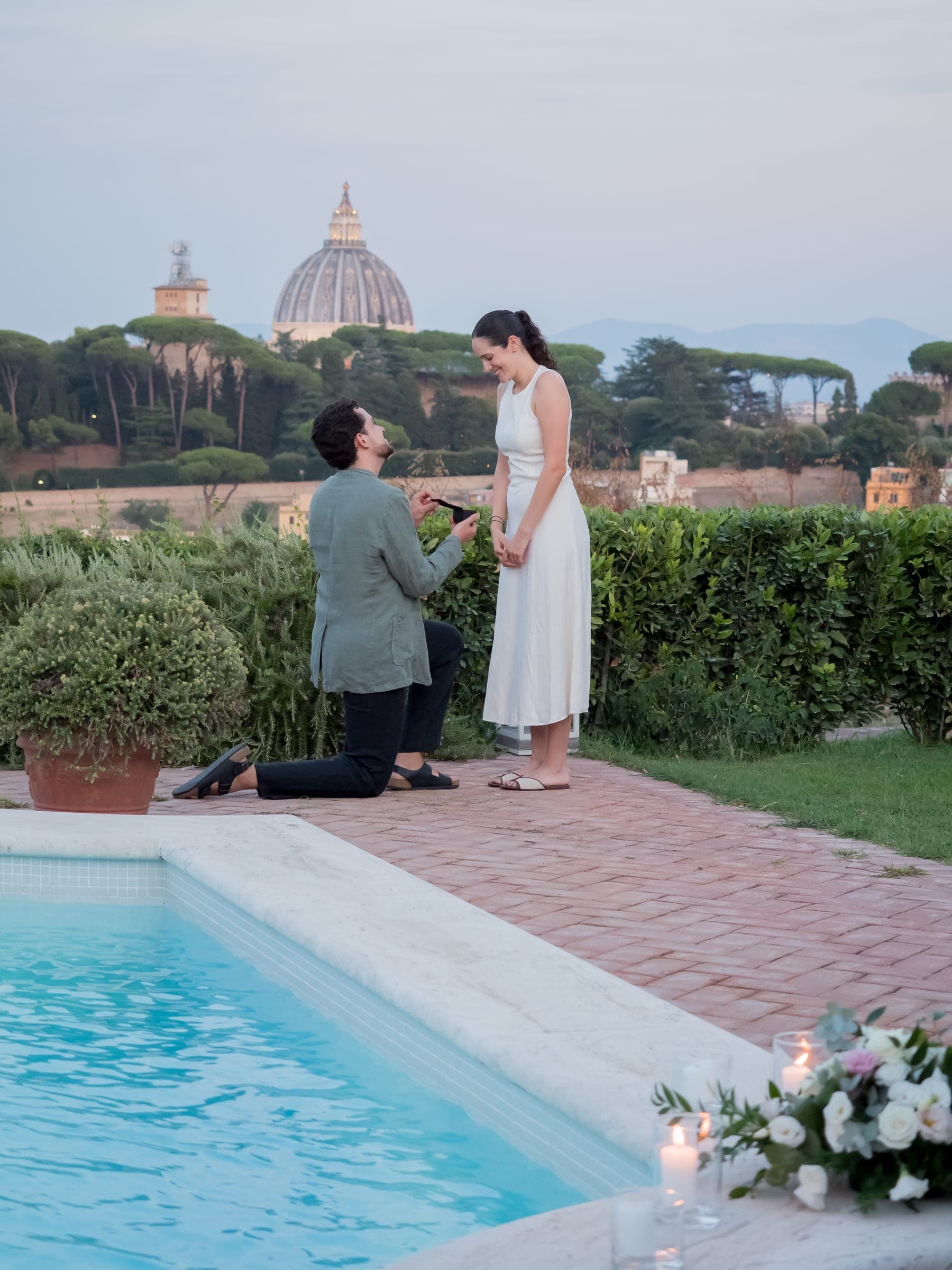 He kneels by the pool on a private rooftop, the dome of St Peter’s on the skyline